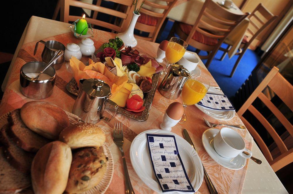 Hotel Am Tierpark غوتا المطعم الصورة